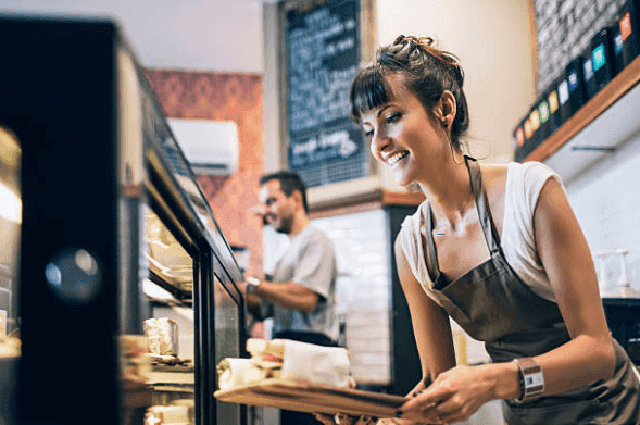 Small business owner in a café - business loans for Australian SMEs and small business owners